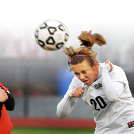 Soccer player heading the ball.