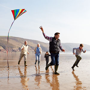 Active family walking on the beach